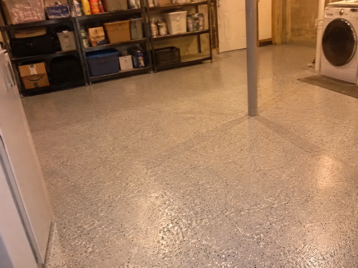 Basement floor after epoxy coating, phone photo sent by the customer