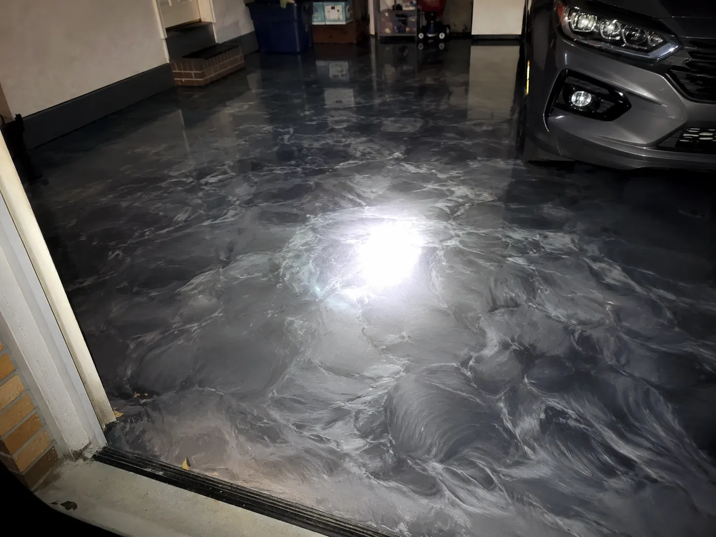 Finished metallic flake epoxy garage floor, phone photo sent by the customer